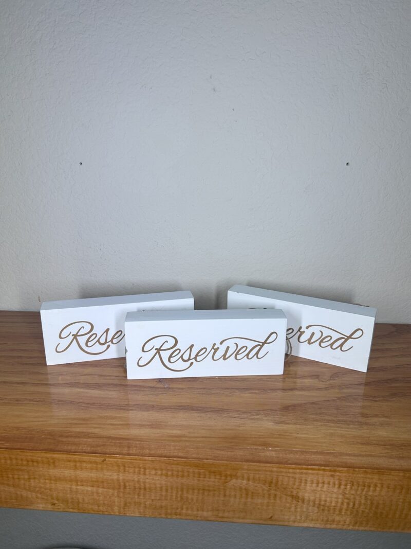 Gold and White Reserve Sign